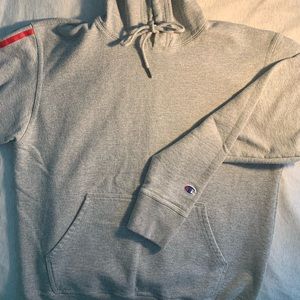 Champion hoodie w/ “champion” on sleeve